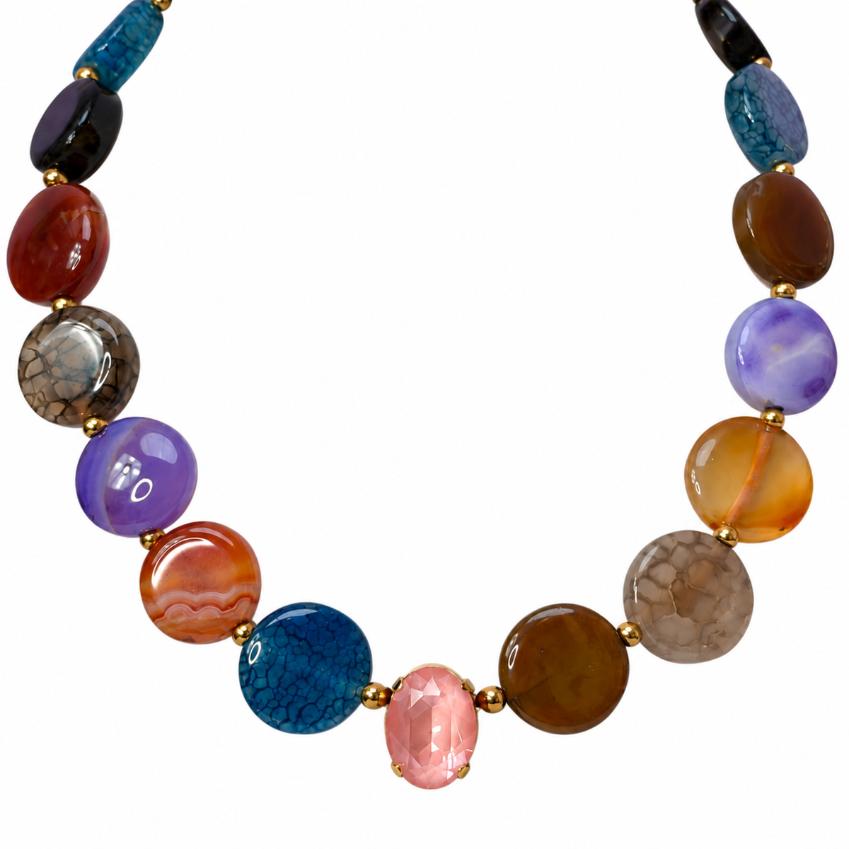 Close-up of colorful round agate beads and a flamingo-colored crystal centerpiece on a white background